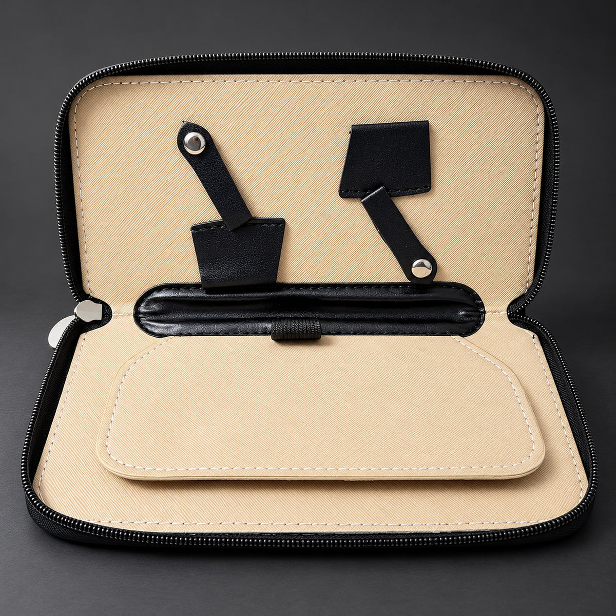 Hairdresser travel case opened flat: blade sleeves, press-stud straps and a padded middle divider